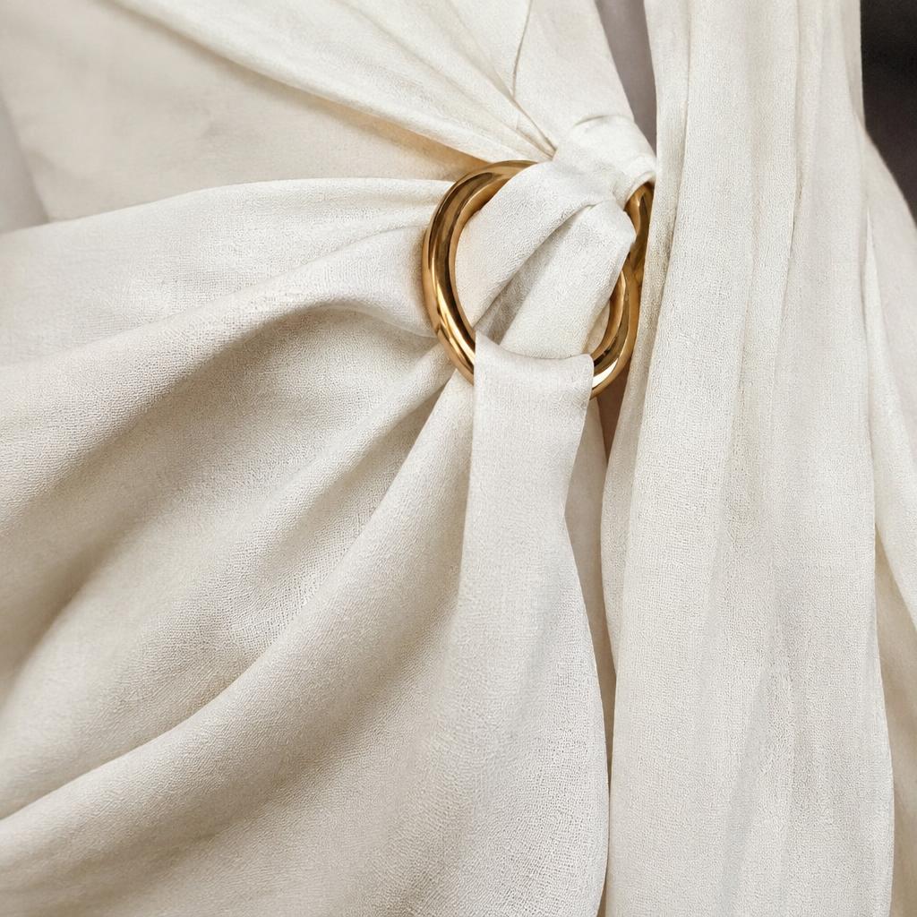 Silk drape with gold ring detail